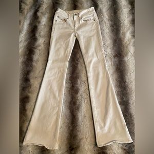 white low rise AE flared jeans    size: 00 regular   small stains on left leg